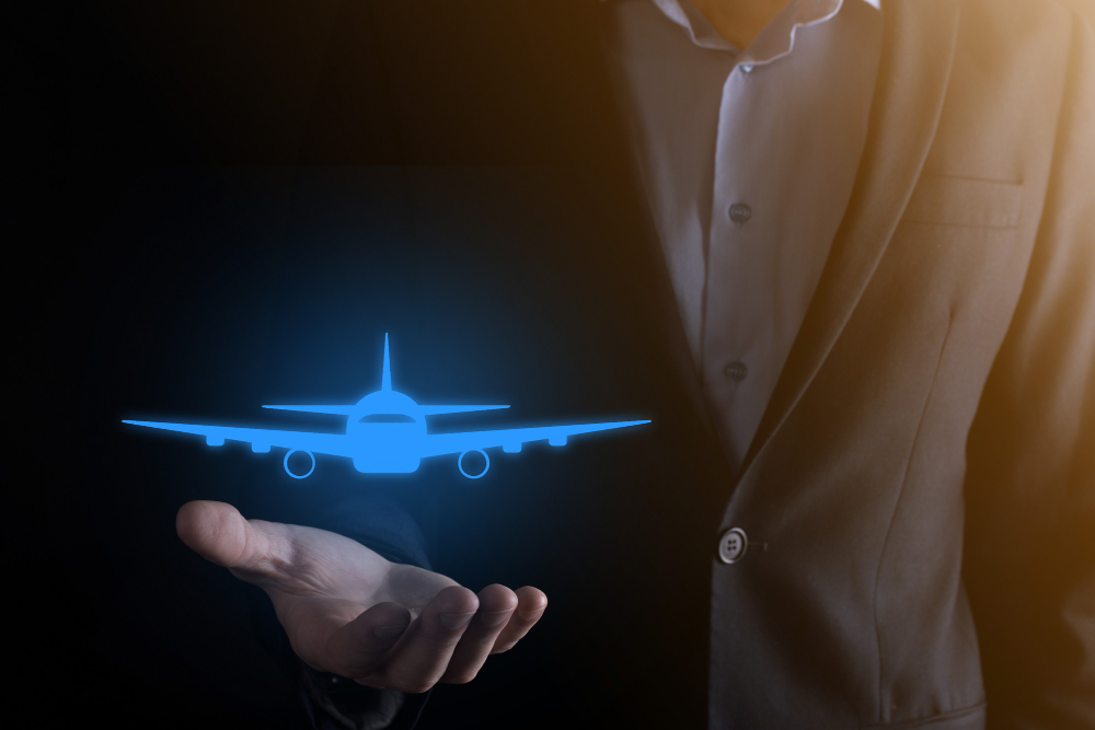 businessman-holding-airplane-icon-his-hands