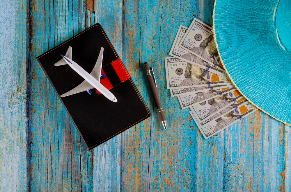 travel-planning-airplane-pencil-blue-hat-notebook-pag-with-blank-space-preparation-traveling